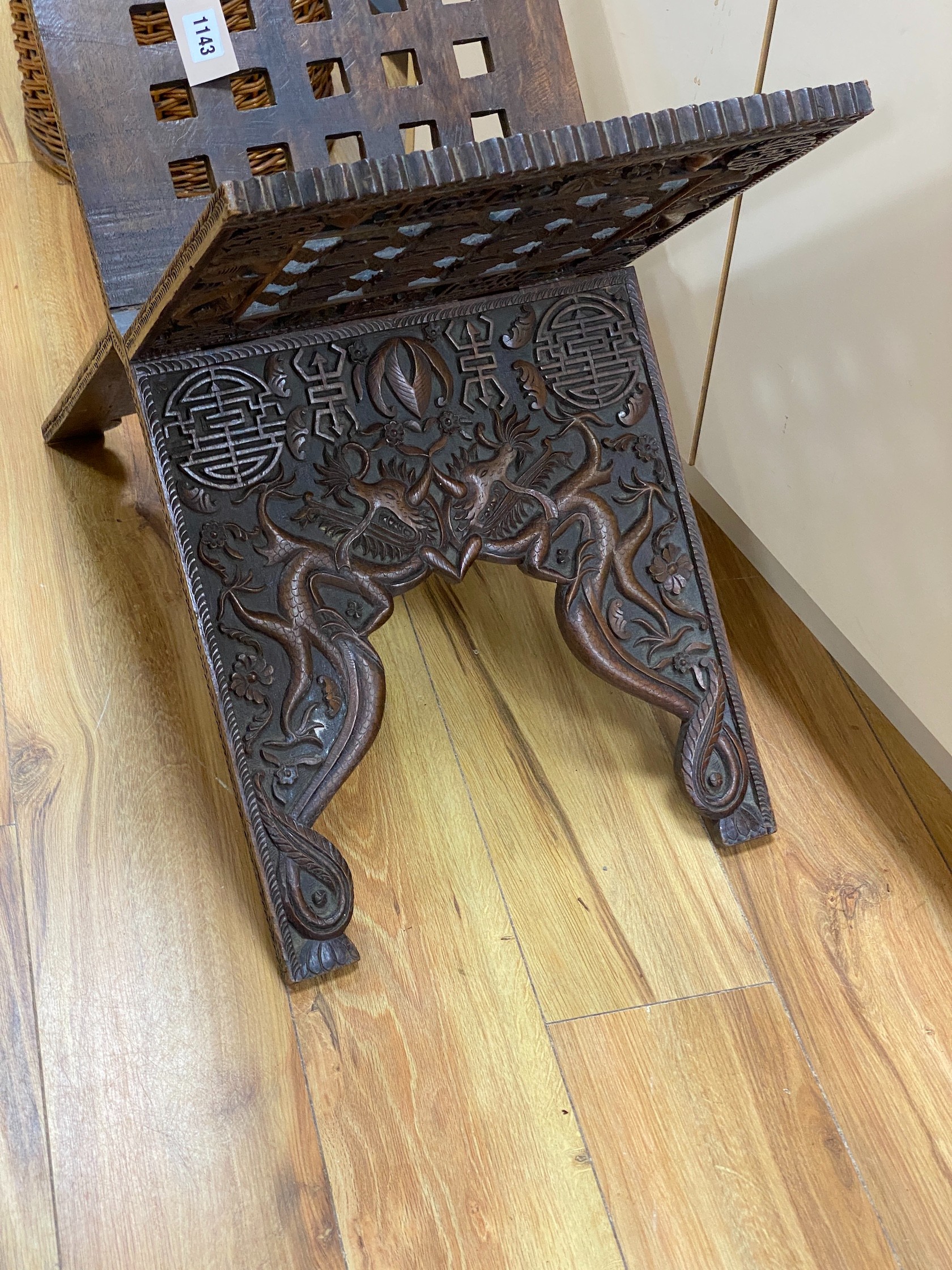 A Chinese carved hardwood folding scriptures stand, height 56cm